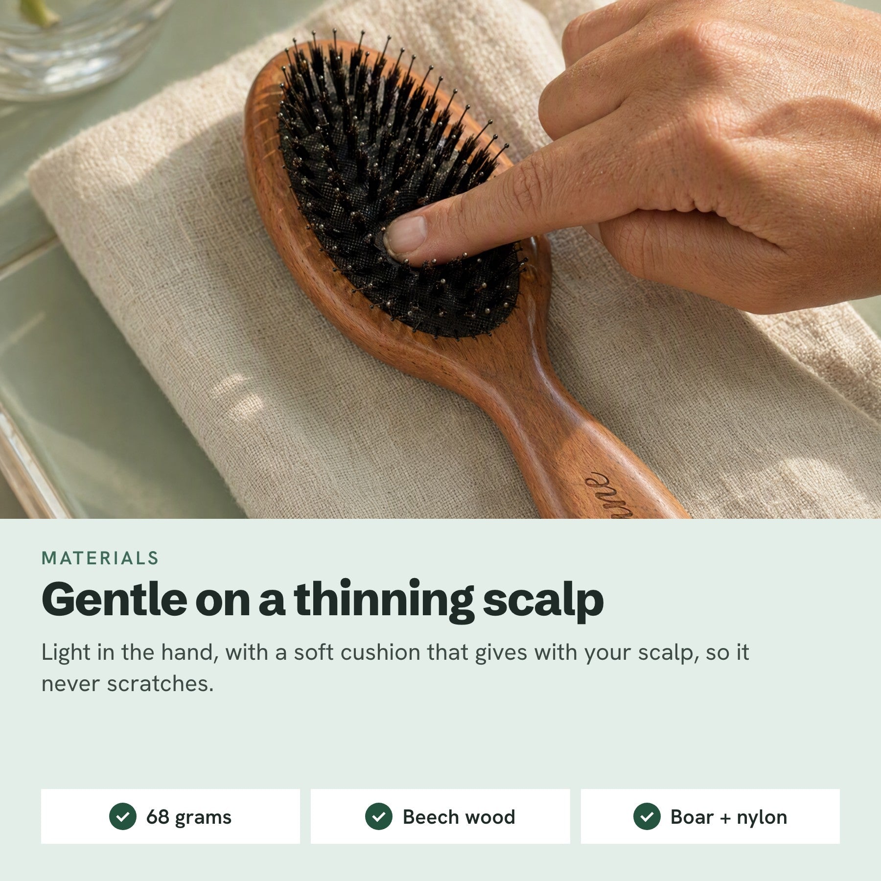Material macro: the cushion gives under a fingertip; the page specs